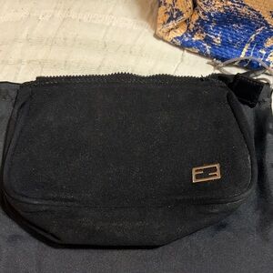 Black Fendi pouch. Great to keep items in and not ruin the inside of your bag.